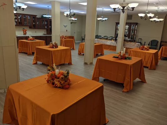 Interior of a decorated activity room with orange tables