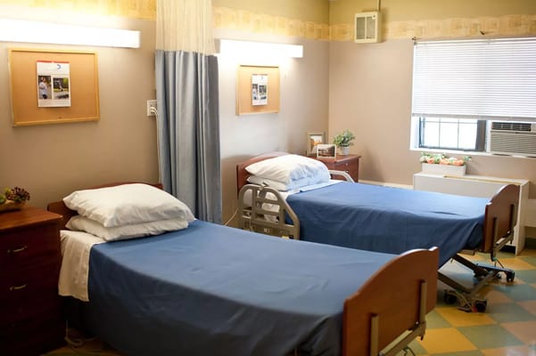 Shared resident room with two beds and windows