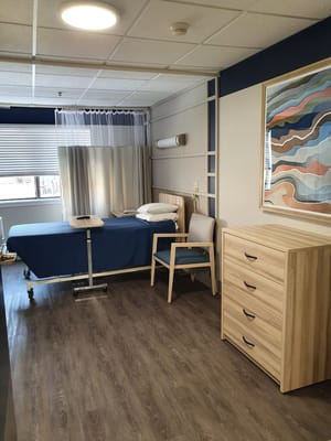 A private resident room with a bed and storage