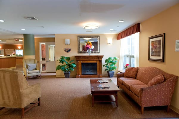 Cozy common area with seating and a fireplace