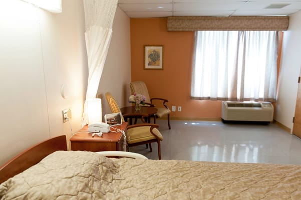 A cozy resident room with natural light