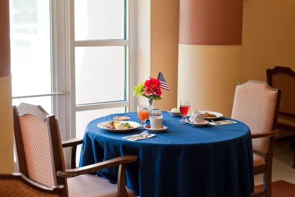 Dine-in setup with meals and drinks on a table