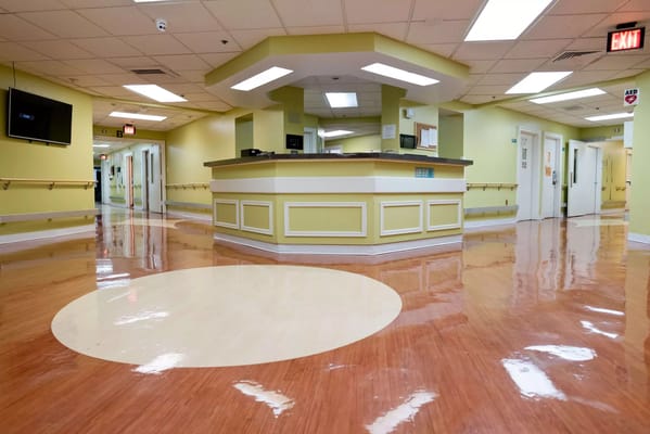 Bright corridor with reception area in a nursing facility