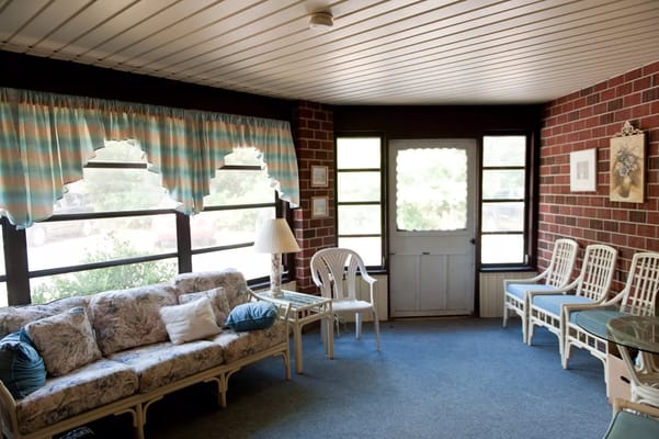 Bright common area with seating and large windows