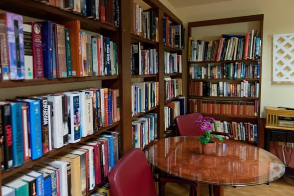 Cozy library space with bookshelves and a table