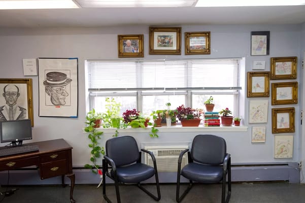 Cozy common area with chairs and plants