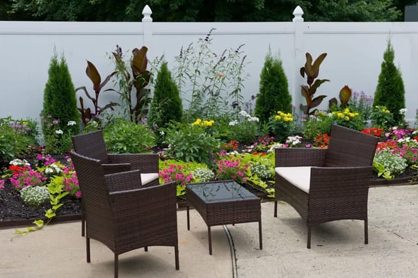 Seating area with flowers in a garden.
