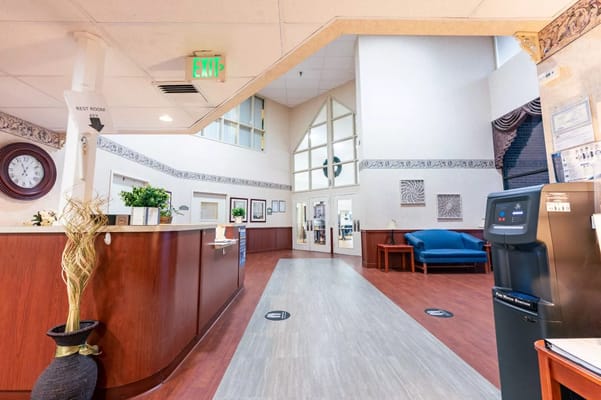 Interior view of the lobby at Autumn Lake Healthcare, featuring a reception desk and seating area.