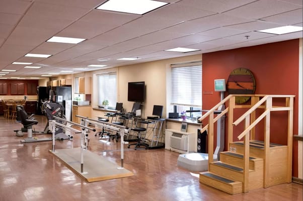 Rehabilitation area with exercise equipment and therapy room