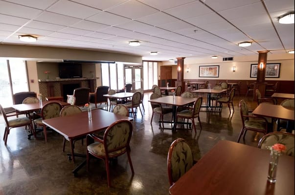 Bright dining area with tables and chairs