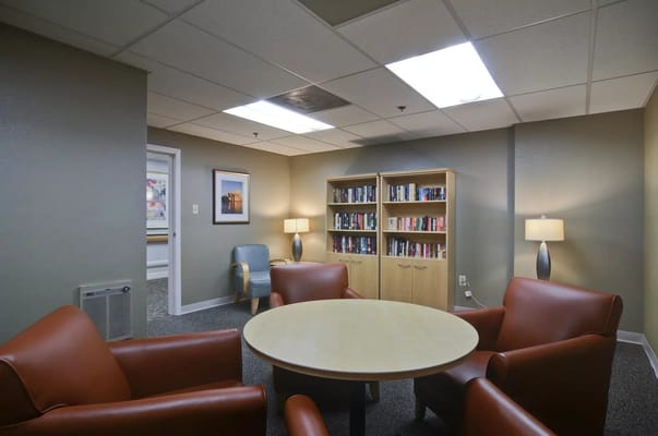 Cozy common area with seating and bookshelves