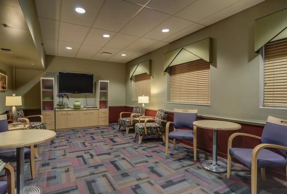 Cozy common area with seating and TV