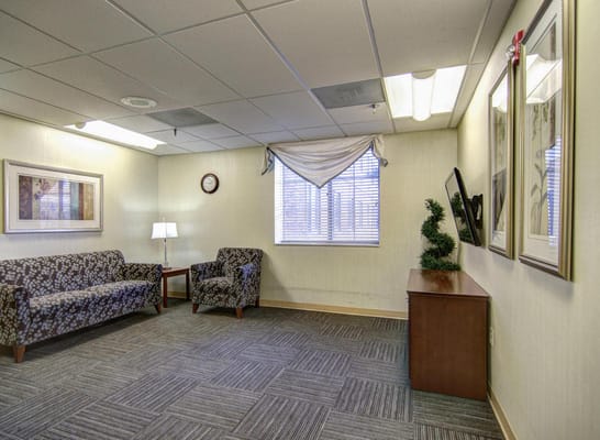 Cozy common area with seating and wall art