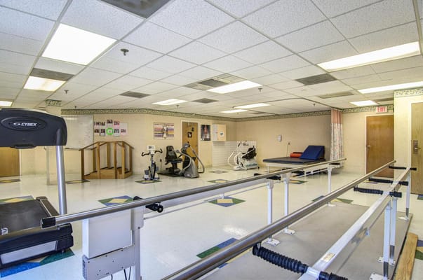Interior view of a therapy room with exercise equipment