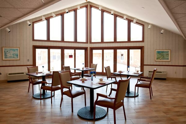 Dining area with large windows and tables