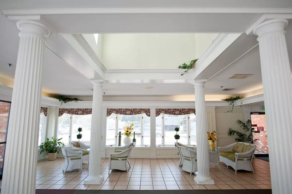 Bright common area with seating and natural light