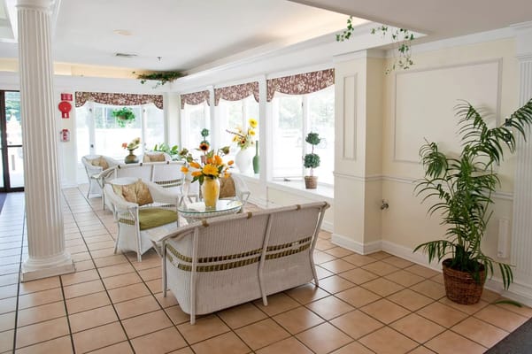 Bright lobby area with seating and plants