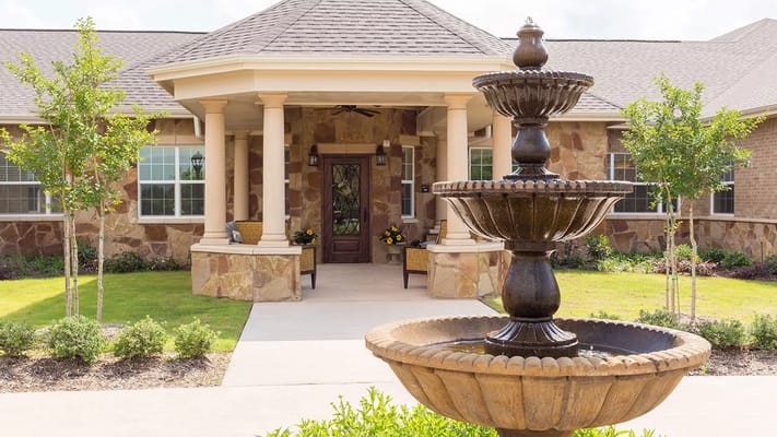 Exterior view of the facility with a fountain