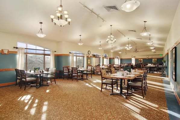 Bright and spacious dining room with tables