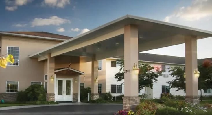 Entrance of a senior living facility with covered porch