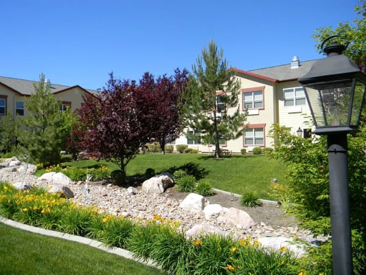 Beautiful landscaped garden with trees and flowers