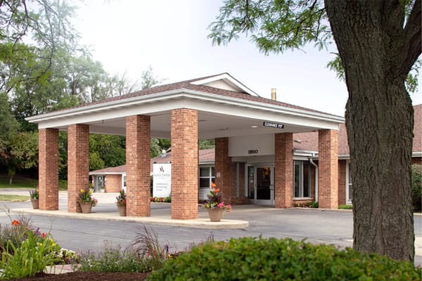Front entrance of Avantara Elgin with flower pots