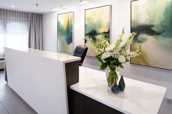 Bright interior lobby with flowers and artwork