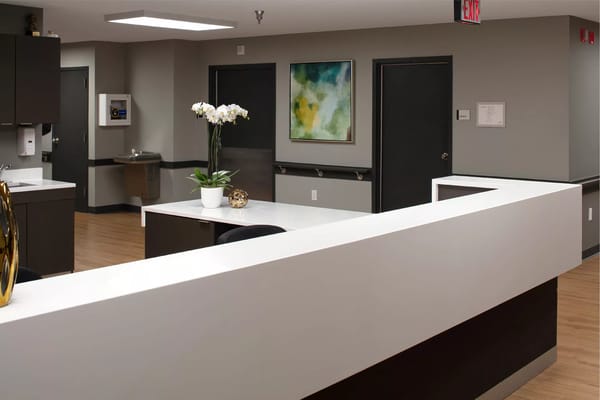 Bright reception area with modern decor and plants