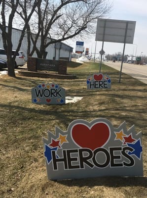 Exterior view of Avantara Groton with promotional signs