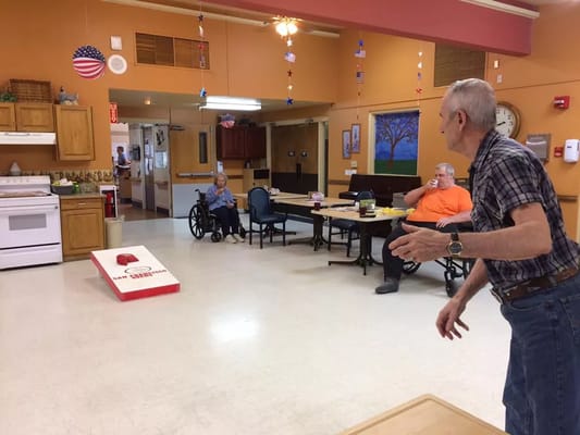 Residents playing a game in the activity room