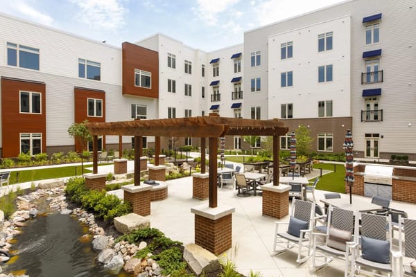 Outdoor patio area with seating and landscaping