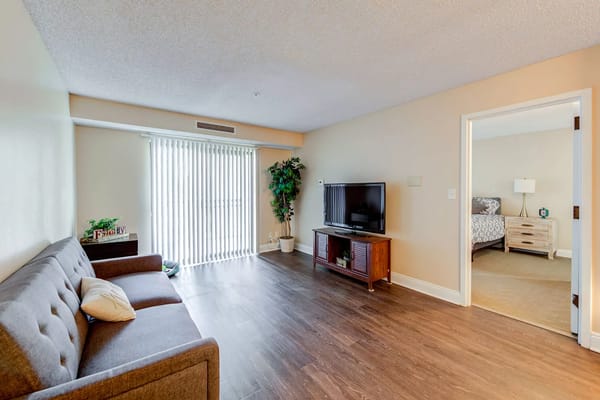 Cozy living room area with a sofa and television