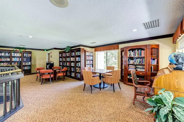 Interior view of a library with bookshelves and seating