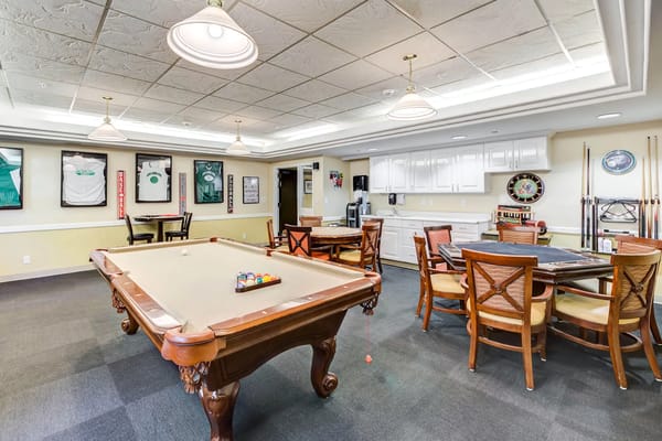 Common area with pool table and seating for residents