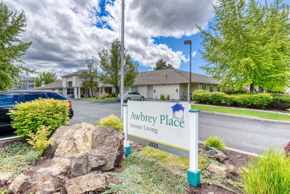 Sign for Awbrey Place Senior Living at the entrance