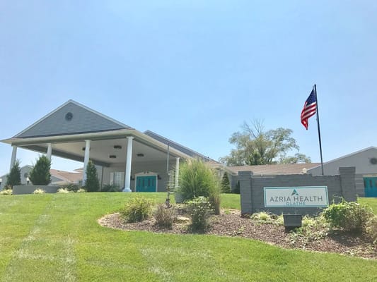 Exterior view of Azria Health facility with landscaping