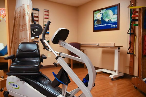 Well-equipped therapy room with exercise equipment