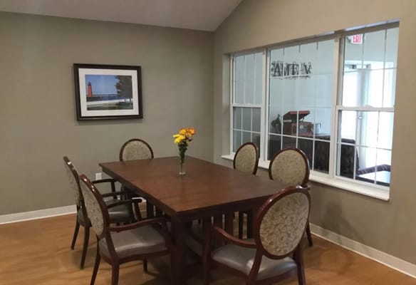 Interior common area with a dining table and flowers