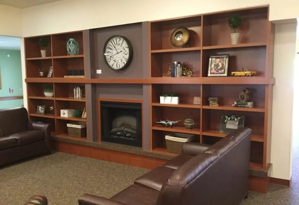 Interior common area with bookshelves and seating