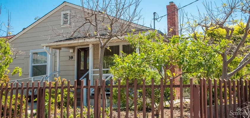 Exterior view of a residential style building with trees