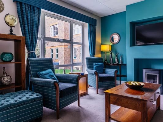 Cozy common area with comfortable seating and blue decor