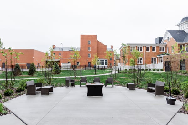 Outdoor space with seating and greenery