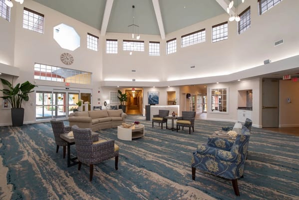 Spacious and inviting lobby with seating areas and decorative plants