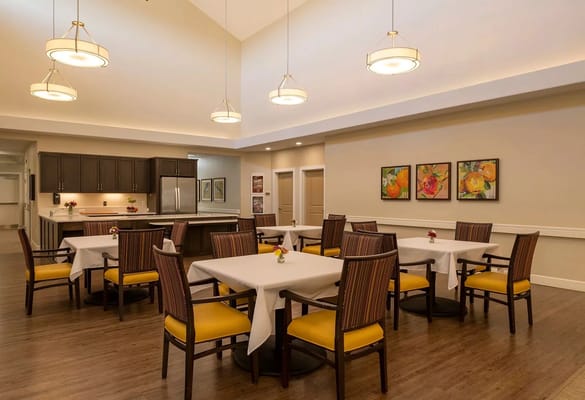 Bright dining area with tables and chairs