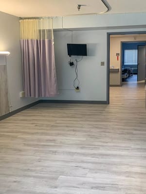 Interior view of a resident room with basic furnishings