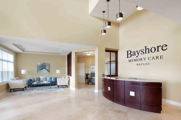 Lobby area at Bayshore Memory Care with comfortable seating and reception desk.
