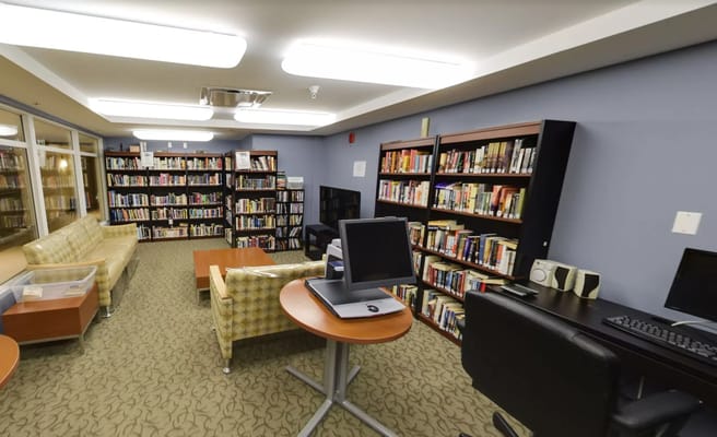 Interior view of a library with bookshelves and seating