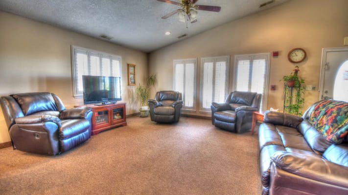 Comfortable lounge area with seating and a television