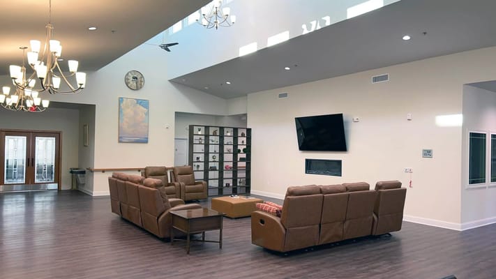 Interior common area with seating and large windows