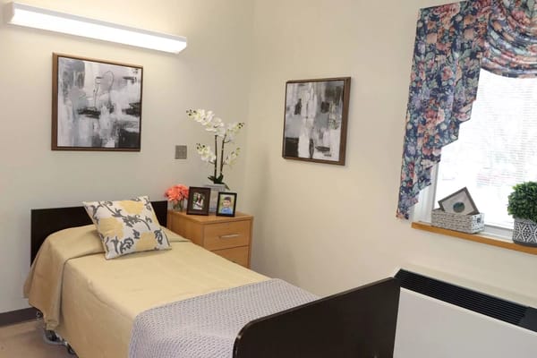 Cozy resident room with bed and decor